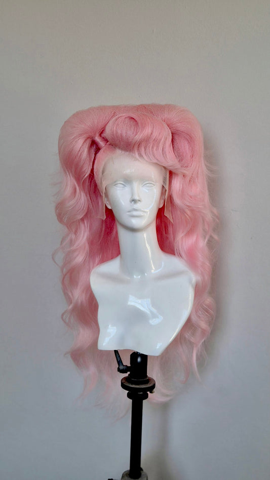 Pink teased out half up pigtails